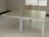 Beam desks face to face each with own leg system